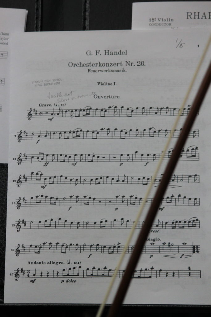 Sheet music by Handel with a bow on top