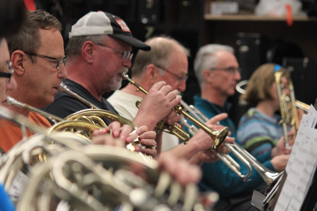 The brass section playing at a concert