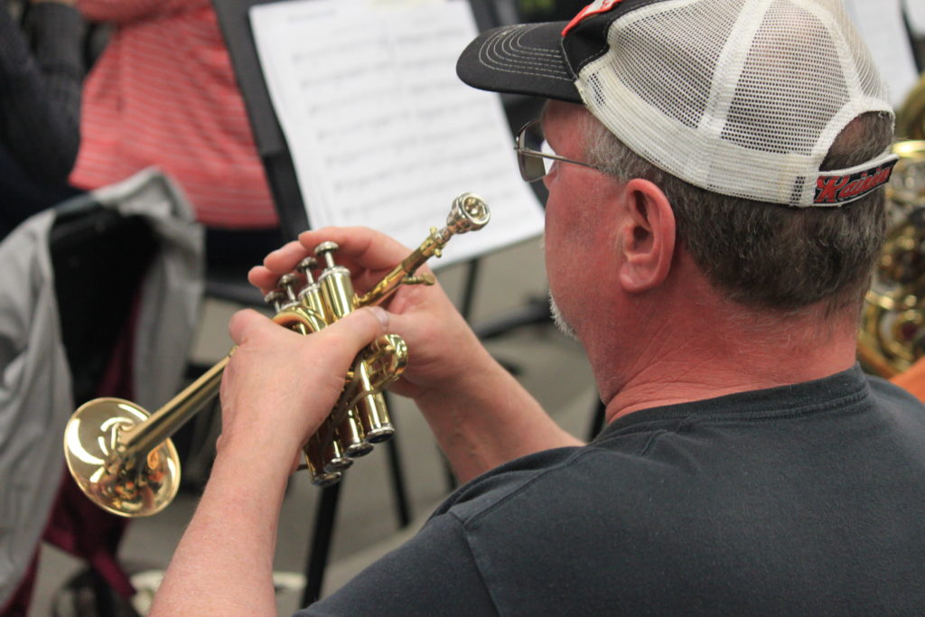 Close up of a man playing the trumpet