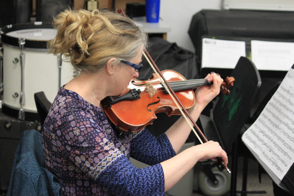 Close up of a woman playing the violin