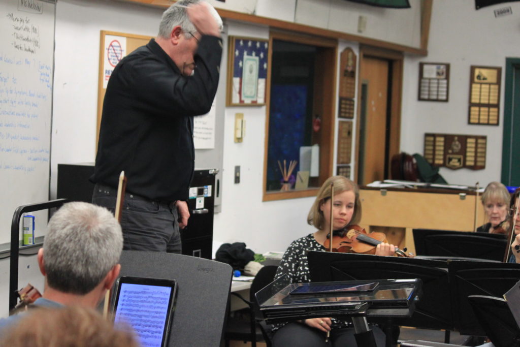 Orchestra practicing in a classroom
