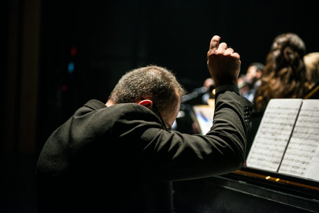 A conductor conducting a concert